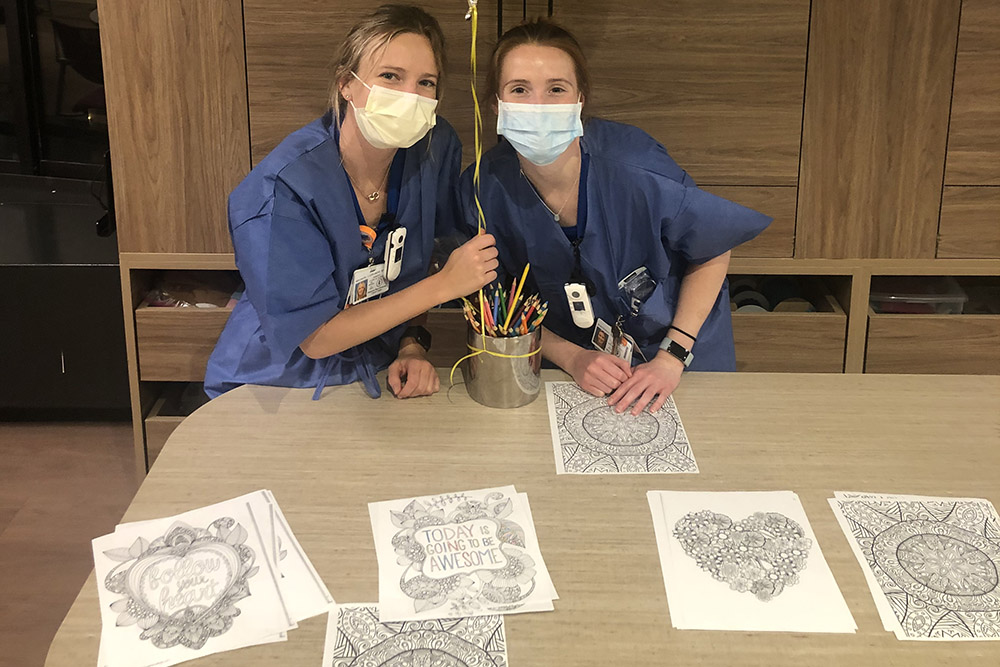 UVA Nursing grad Cate Rhangos  (BSN `19) coloring in break room during 2020 COVID-19 pandemic
