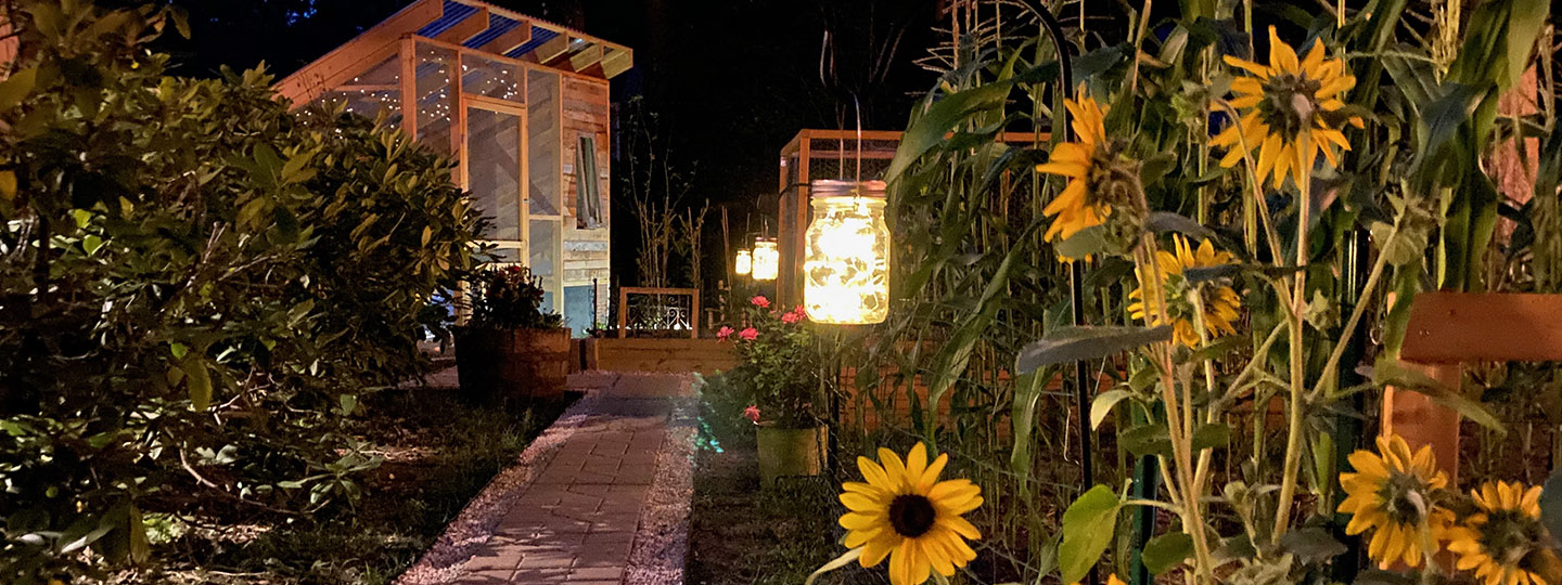 An image of DNP student and ER nurse Ashley Apple's chicken coop and garden at night.