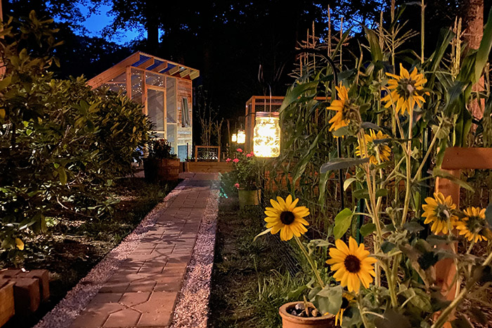 An image of DNP student and ER nurse Ashley Apple's chicken coop and garden at night.