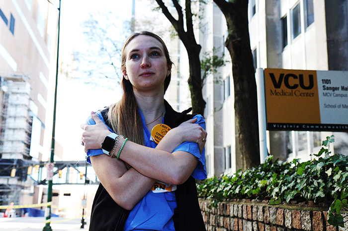 BSN graduate and ICU nurse Sydney Quigley on a street outside of VCU Medical Center where she works.