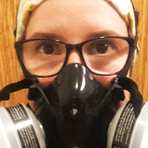 Graduate Kimmi Oldham Alderfer in a respirator mask.