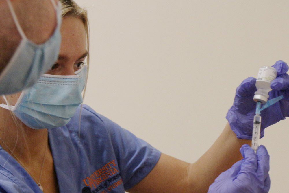 An image of a BSN student practicing administering vaccines, part of students' community health clinicals.