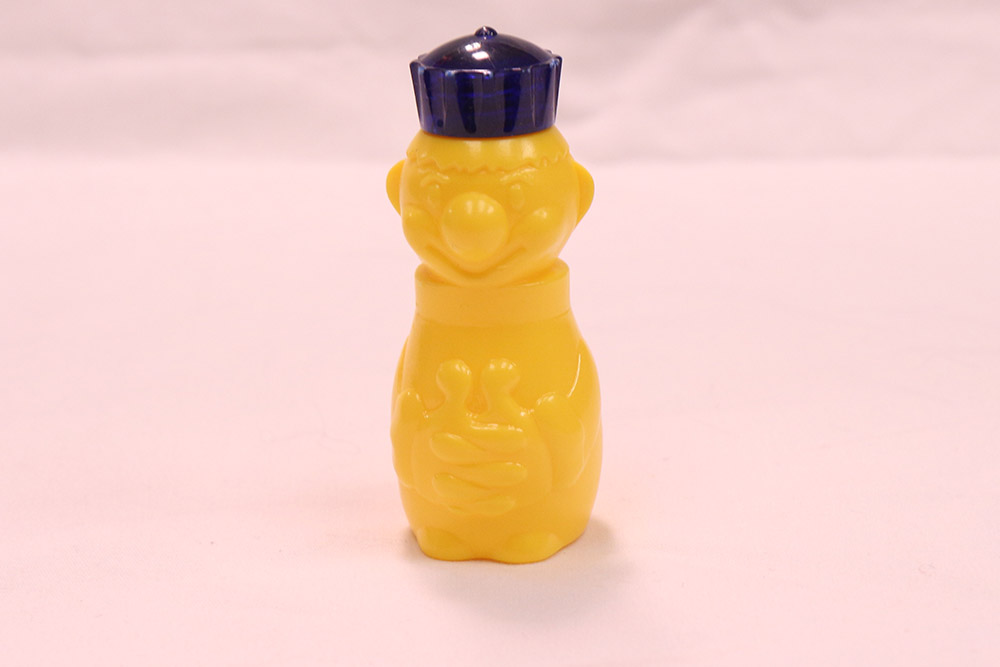 a clown shaped medicine container toy for children from the Bjoring Center
