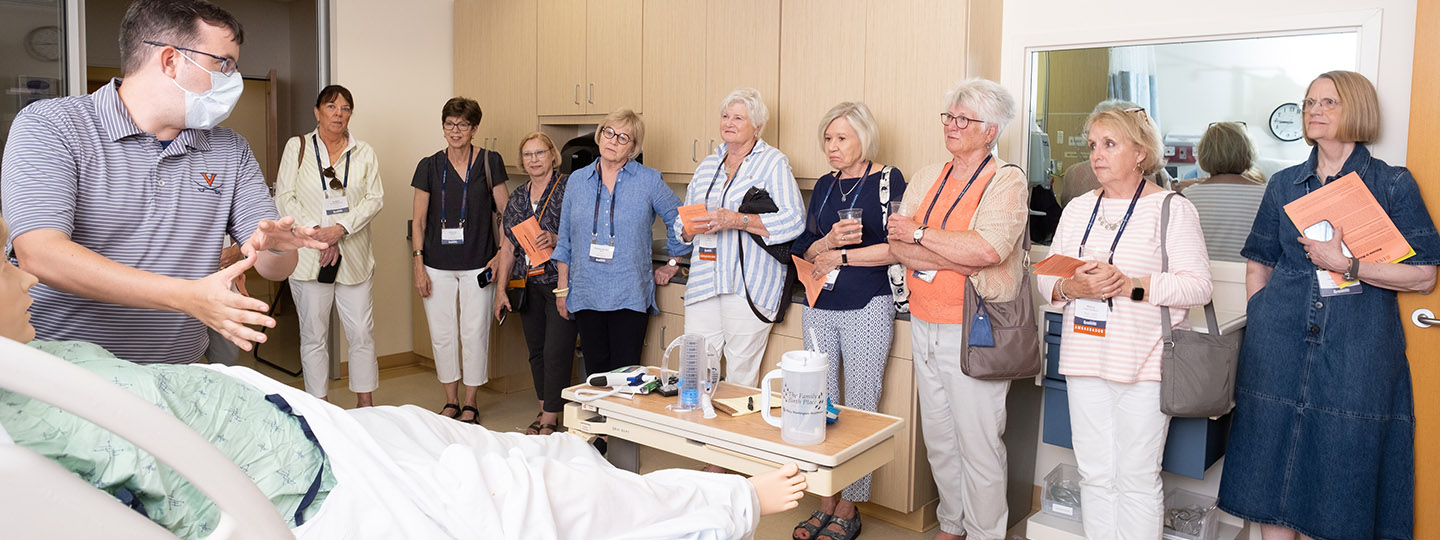 The nursing classes of 1971 and 1972 gathered for the first in-person reunions in June since 2019 to celebrate their 50th graduation reunion and their induction into the Thomas Jefferson Society. Here, Ryne Ackard, sim lab director, demonstrates how the birthing mannequin Noelle operates.