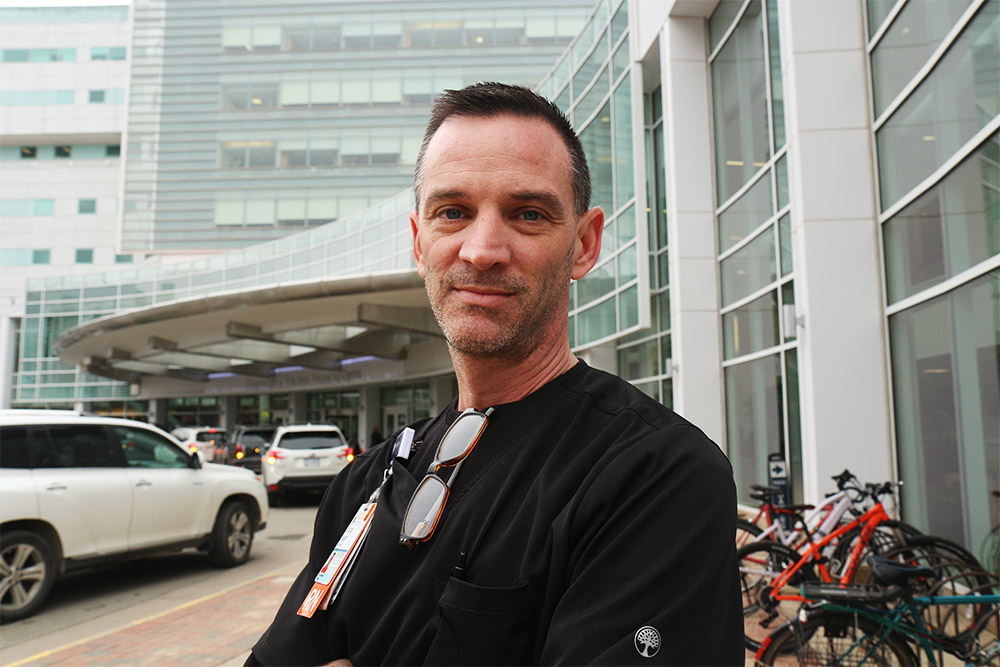 Scott Austin (BSN `18) nurse manager at UVA Health's COVID unit on 3 W.