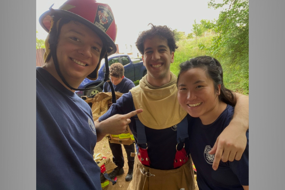 Three first responders smiling outdoors