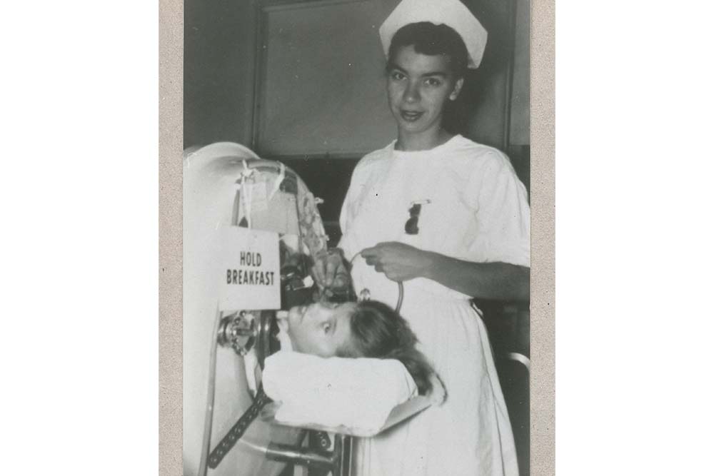 historical photo of a nurse and polio patient