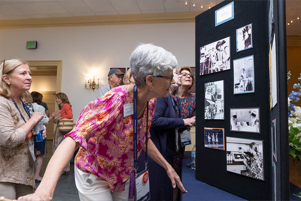 A woman peering at a display