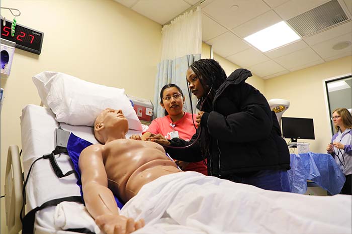 A high schooler in the sim lab at the 2024 Dare to Dream recruitment event.