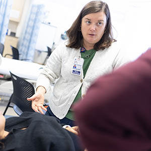 A nursing professor in a lab