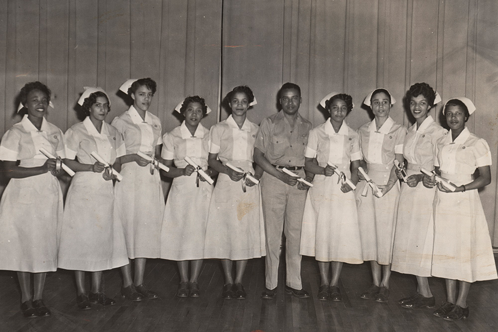 An image of the first male graduate of UVA School of Nursing Chester O. Gray (LPN ’56) and his classmates.
