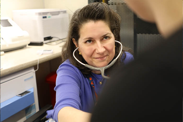 Assistant professor and pediatric NP Amy Boitnott sees a patient.