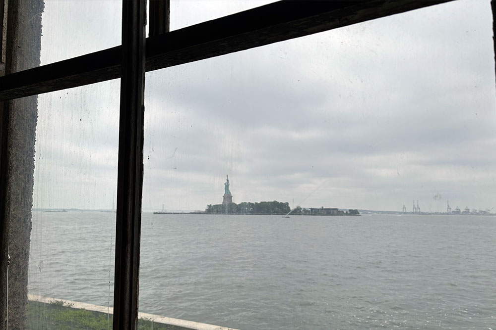 Statue of Liberty through Ellis Island window