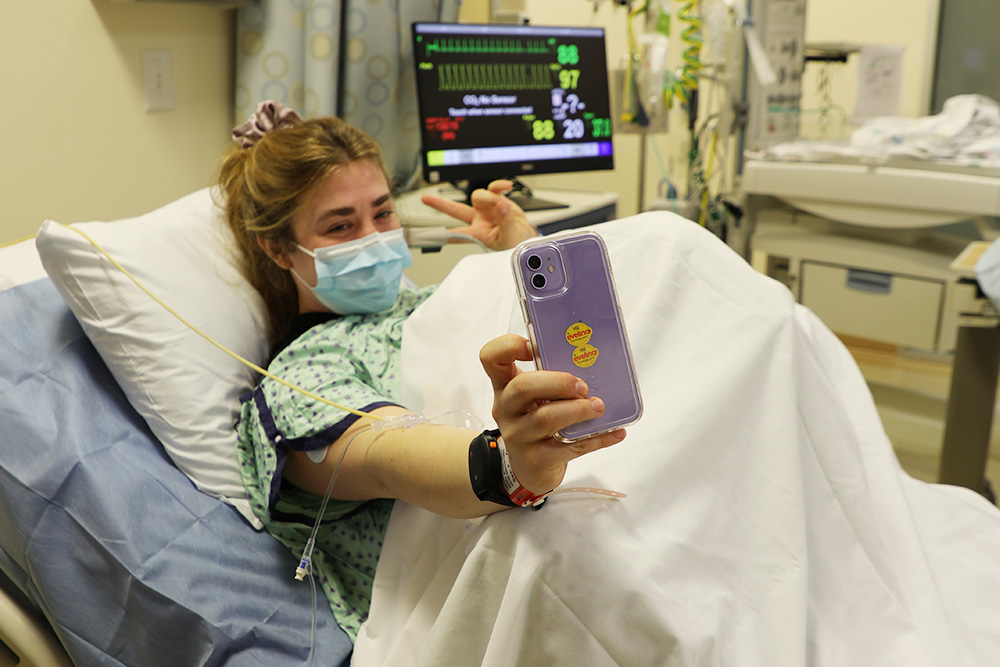 Birthing simulation - standardized patient Abby Collins takes a selfie